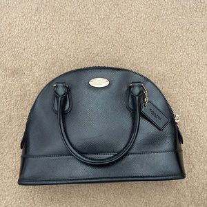 Coach small zip top purse.